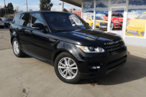land rover reliability, european auto repair in Englewood, CO at AutoImports of Denver. Black Range Rover parked outside an auto repair shop.