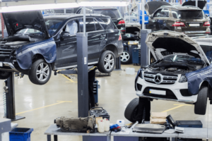 mercedes service a, european auto repair in Englewood, CO at AutoImports of Denver. Mercedes-Benz SUVs on lifts in a professional auto repair shop undergoing maintenance.