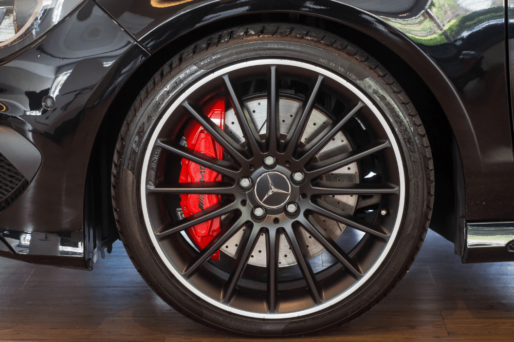 mercedes brake repair, European auto repair in Englewood, CO at AutoImports of Denver. Mercedes-Benz AMG performance brake system featuring a drilled rotor and red caliper.