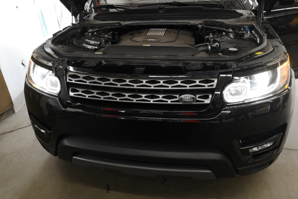 land rover repair in Denver, European auto repair in Englewood, CO at AutoImports of Denver. Image of black Land Rover SUV being serviced inside a professional repair shop.