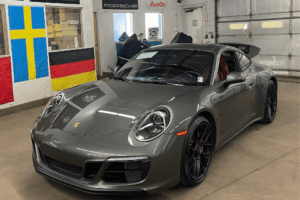 Porsche repair in Denver, CO by AutoImports of Denver. Image of a gray Porsche 911 inside the shop, highlighting the team’s commitment to precision maintenance, performance, and care for European luxury vehicles.